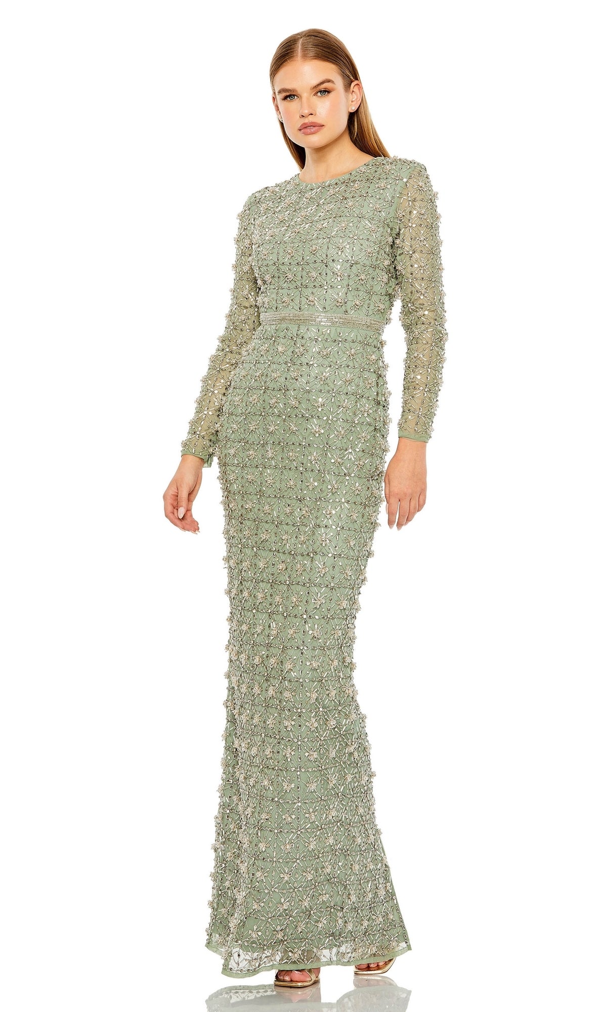 A woman wears the Mac Duggal Long Formal Dress 93827—a light green, floor-length gown with long sleeves, intricate beadwork, and a fitted silhouette.
